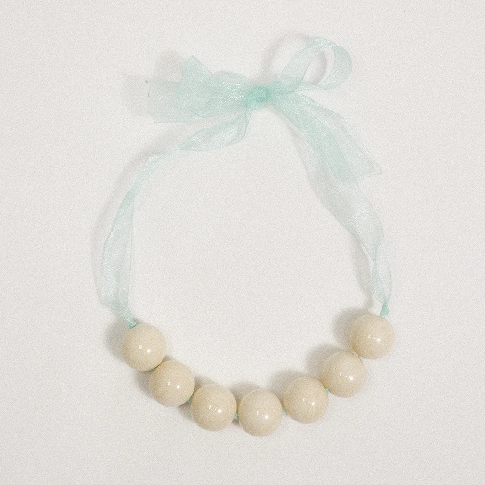 Creamline bow necklace