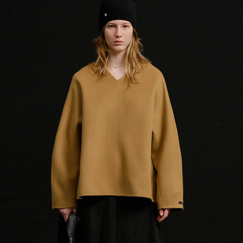 Her wool handmade top