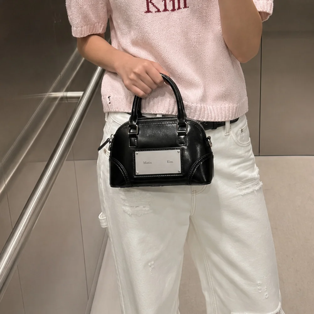 CURVE ZIP MINI BAG IN BLACK