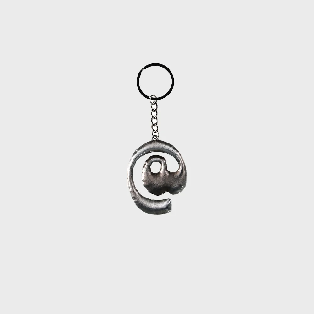 At symbol logo keyring