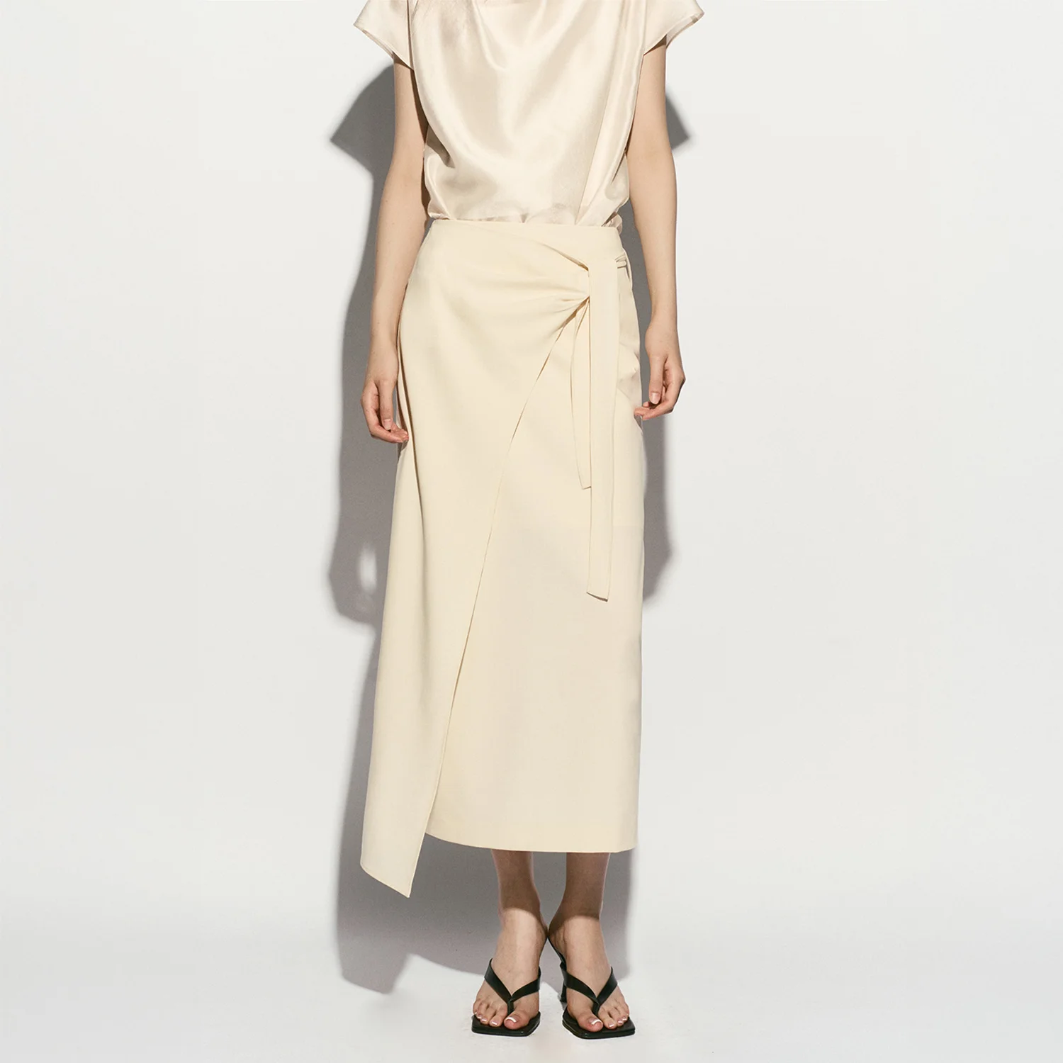 ASYMMETRIC HEM SIDE TIE SKIRT