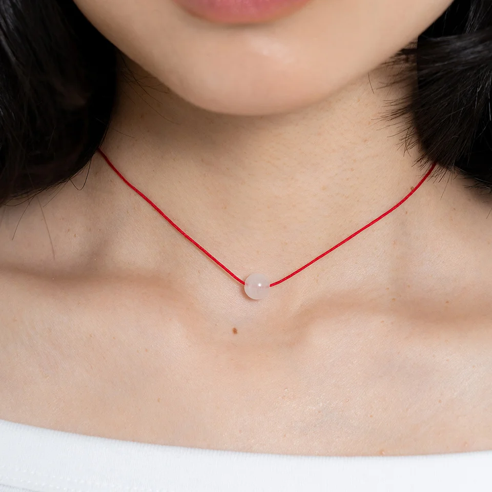 red string ball necklace