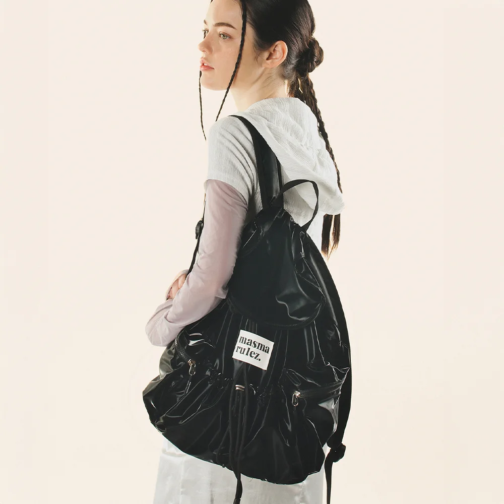 String flap backpack _ Glittery black