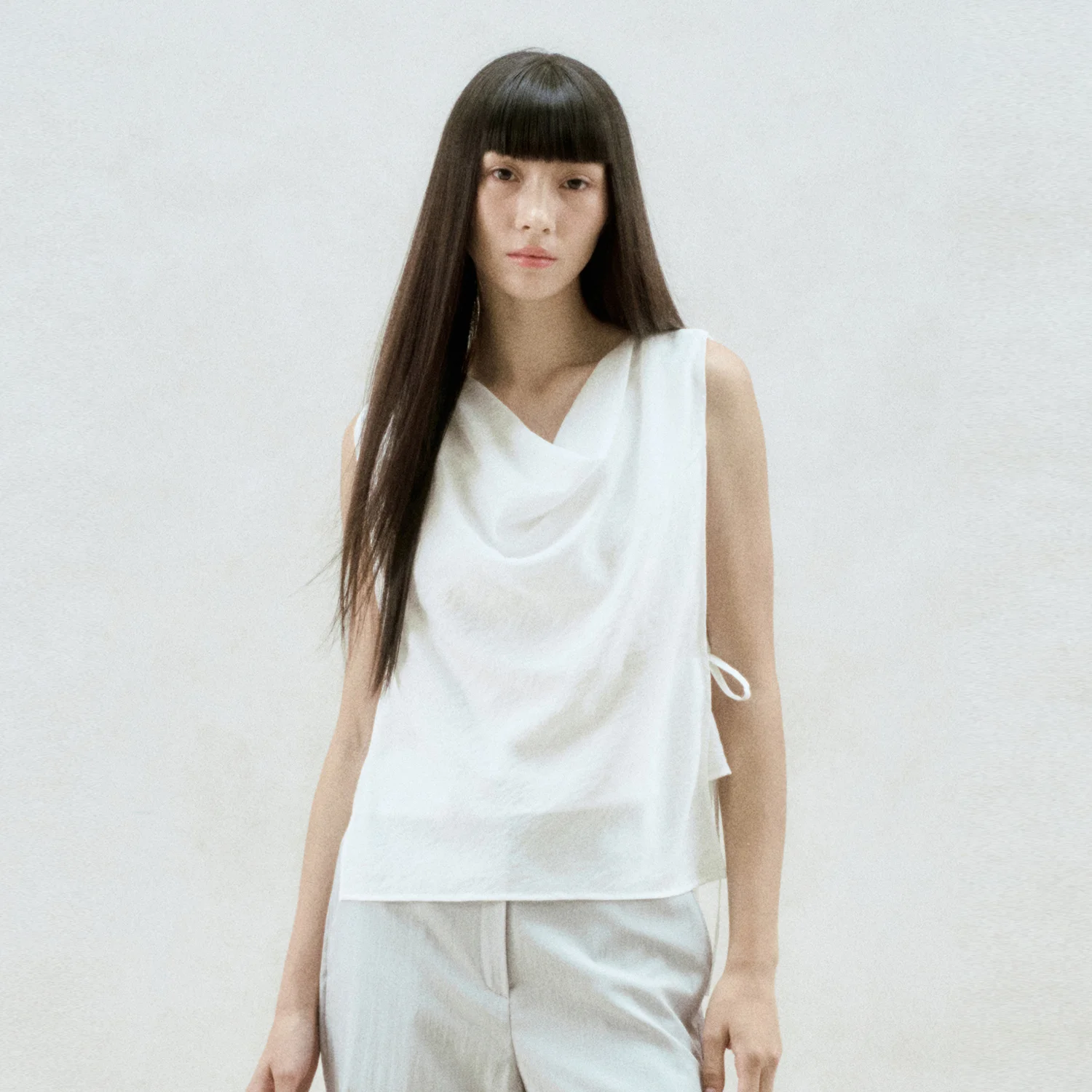DRAPED NECK SLEEVELESS BLOUSE