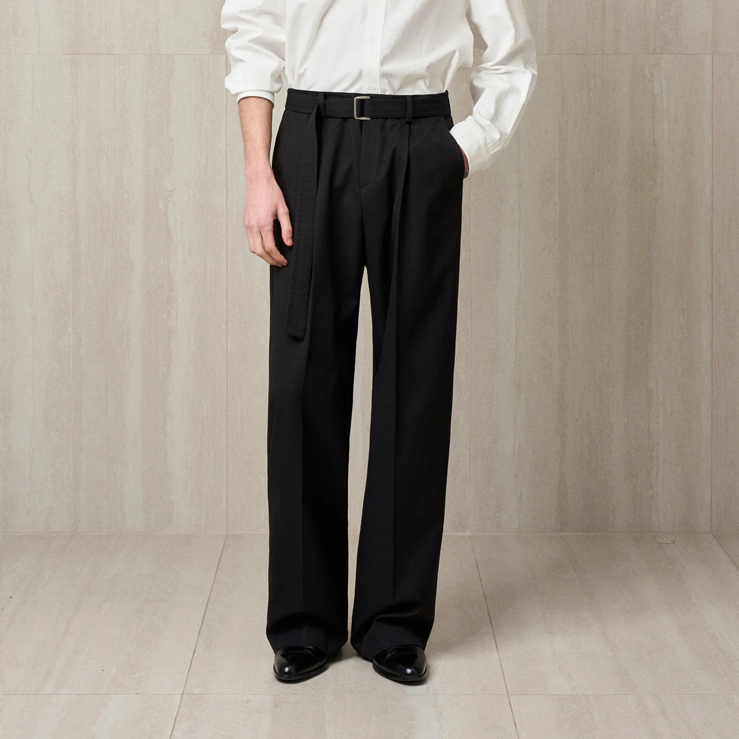 PLEATED BELTED TROUSERS
